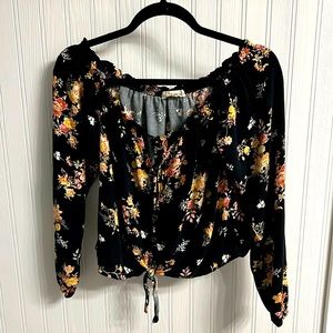 Cute top! Two string ties in front with line of buttons. Size medium.